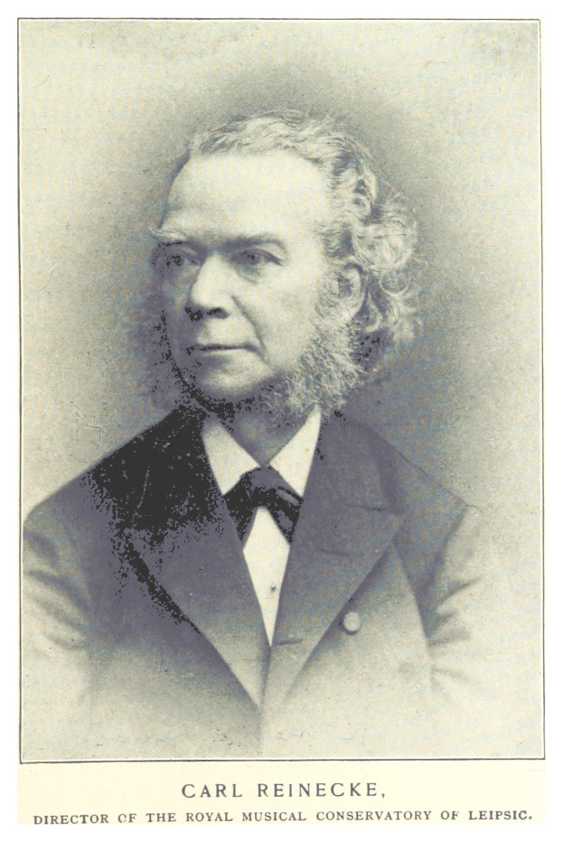 Schwarz-weiß-Porträt von Carl Reinecke, Direktor des Königlichen Musik-Konservatoriums Leipzig, in einem Anzug mit Text unten.