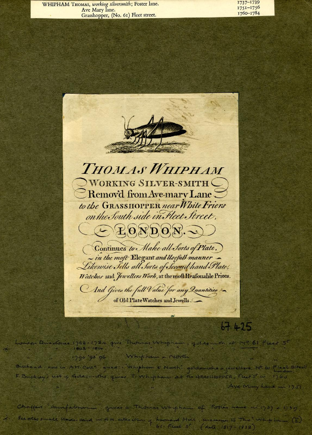 Altes Buch mit einer Zeichnung einer Heuschrecke auf dem Cover, das handgeschriebene Text auf dem Papier enthält.