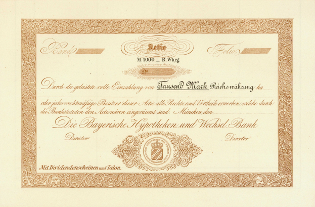 Alte Aktienurkunde mit goldenem Rand, die ein Porträt eines Mannes und Text zeigt