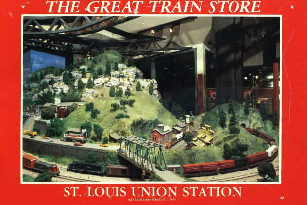 Ein Plakat mit einer Eisenbahn, die über eine Brücke mit einer Truss-Struktur fährt, umgeben von Pflanzen, Häusern und Hügeln.