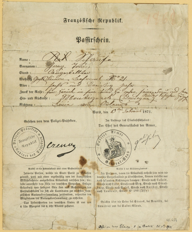 Altes deutsches Regierungsdokument mit einem kreisförmigen schwarz umrandeten Stempel auf gelbem Papier, geschrieben in schwarzer Tinte.